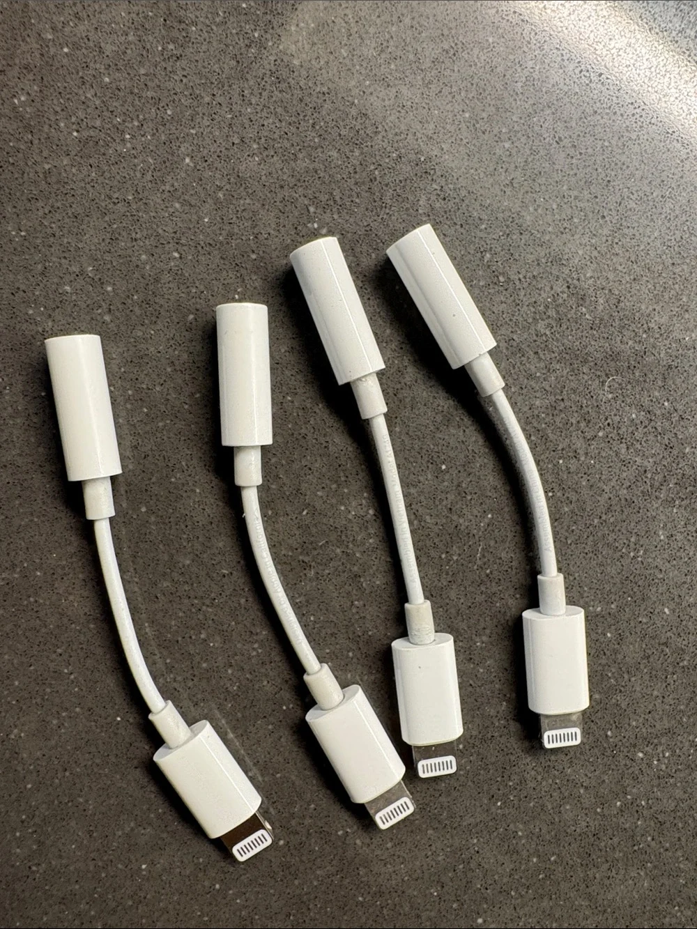 Apple Lightning to 3.5mm Audio Adapter Pack - White. Set of 4